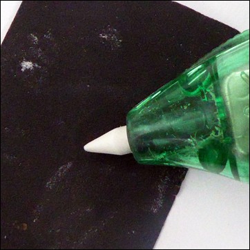 Sharpening the rubber nib of a battery eraser with wet and dry paper